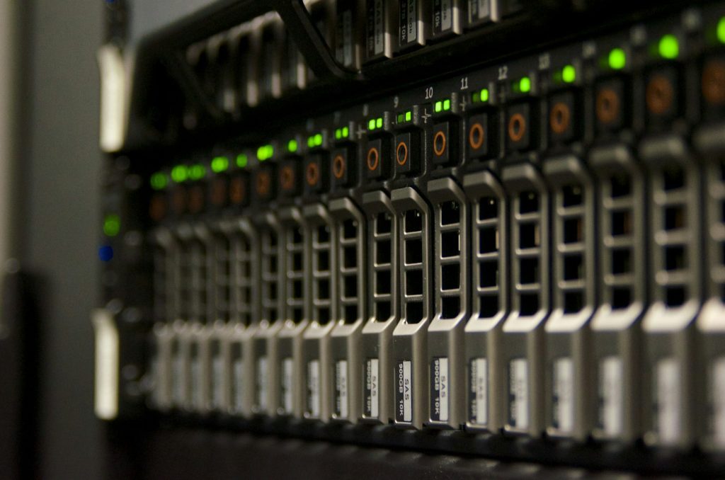 Server rack with green status lights in a web hosting data center